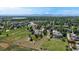 An aerial view showcases the home's large lot, landscaping, play area, and its location within a quiet community at 14652 Kalamath Ct, Westminster, CO 80023