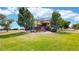 A backyard oasis with a dining area on the deck and lush greenery offers a tranquil escape at 14652 Kalamath Ct, Westminster, CO 80023
