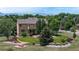 This spacious backyard includes mature trees, well-manicured lawn, a playground, and scenic mountain views at 14652 Kalamath Ct, Westminster, CO 80023