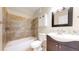 Bathroom with a sleek vanity, decorative mirror, and a toilet at 14652 Kalamath Ct, Westminster, CO 80023