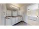 Bathroom with granite countertops and dual sinks, providing ample space and functionality at 14652 Kalamath Ct, Westminster, CO 80023
