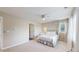 Bright bedroom with neutral walls and carpet, a ceiling fan, and natural light at 14652 Kalamath Ct, Westminster, CO 80023