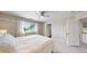 Neutral bedroom with a ceiling fan and large window, offering lots of natural light at 14652 Kalamath Ct, Westminster, CO 80023