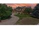 Charming two-story home featuring a three-car garage, lush lawn, and mature trees at 14652 Kalamath Ct, Westminster, CO 80023
