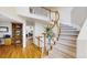 Grand foyer featuring a curved staircase, hardwood floors, and a view of the second floor landing at 14652 Kalamath Ct, Westminster, CO 80023