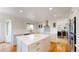 Bright, renovated kitchen with stainless appliances, island and hardwood floors at 14652 Kalamath Ct, Westminster, CO 80023