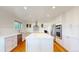 Modern kitchen featuring stainless steel appliances, white cabinetry, and a central island at 14652 Kalamath Ct, Westminster, CO 80023