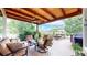 Spacious covered patio with comfortable seating, a ceiling fan, and outdoor views at 14652 Kalamath Ct, Westminster, CO 80023
