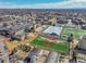 Scenic aerial view showcasing a sports field surrounded by academic buildings and cityscape on a sunny day at 2244 S Franklin St, Denver, CO 80210