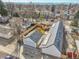 An aerial view of a home with new solar panels, modern design, wooden fence, and convenient garage at 2244 S Franklin St, Denver, CO 80210