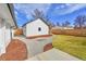 Exterior of a home with a well-manicured backyard, featuring a gravel path and new privacy fence at 2244 S Franklin St, Denver, CO 80210