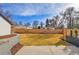 Spacious backyard with a large grass area and wooden fence, offering privacy and charm at 2244 S Franklin St, Denver, CO 80210