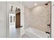 Bathroom features modern fixtures, white subway tile, shower and bathtub at 2244 S Franklin St, Denver, CO 80210