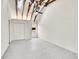 Light-filled bedroom with vaulted ceilings and exposed wood beams, tile floors at 2244 S Franklin St, Denver, CO 80210