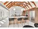 Bright kitchen with wood cabinets, a white countertop island with cooktop, and stainless steel appliances at 2244 S Franklin St, Denver, CO 80210