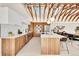 Well-lit kitchen featuring modern cabinets, a spacious island, and stainless steel appliances at 2244 S Franklin St, Denver, CO 80210