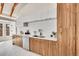 Modern kitchen featuring sleek cabinetry, a white countertop, and stainless steel appliances at 2244 S Franklin St, Denver, CO 80210