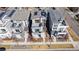 Aerial view of modern homes with rooftop decks and solar panels, showcasing urban living in a vibrant community with easy parking at 6018 Beeler Ct, Denver, CO 80238