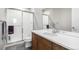 Bathroom featuring a walk-in shower with glass doors and a single sink vanity at 6018 Beeler Ct, Denver, CO 80238