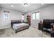 Comfortable bedroom with carpet, neutral paint, and ample natural light at 6018 Beeler Ct, Denver, CO 80238