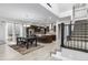 Bright, open-concept kitchen and dining area with modern stainless steel appliances and lots of natural light at 6018 Beeler Ct, Denver, CO 80238