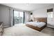 Spacious main bedroom with sliding glass doors that lead to a private balcony at 6018 Beeler Ct, Denver, CO 80238