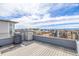 Enjoy city views from this home's rooftop deck with a built-in grilling area, perfect for entertaining guests and enjoying outdoors at 6018 Beeler Ct, Denver, CO 80238