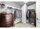 Organized walk-in closet with shelving, hanging rods, and a dresser at 6018 Beeler Ct, Denver, CO 80238
