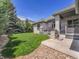 Spacious backyard features a lush lawn and privacy landscaping, creating a serene outdoor oasis at 4704 W Hinsdale Ct, Littleton, CO 80128