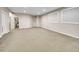 Spacious basement with neutral carpet and paint, plus egress windows at 4704 W Hinsdale Ct, Littleton, CO 80128