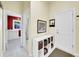 Functional entryway with storage, convenient access to the laundry room, and a neutral color palette at 4704 W Hinsdale Ct, Littleton, CO 80128