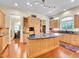 Gourmet kitchen with custom cabinets, granite countertops, and stainless steel appliances at 4704 W Hinsdale Ct, Littleton, CO 80128