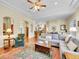 Spacious living room with an open layout, plush seating, and views into the kitchen and dining area at 4704 W Hinsdale Ct, Littleton, CO 80128