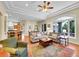 Bright and airy living room with hardwood floors, a large window, and comfortable seating at 4704 W Hinsdale Ct, Littleton, CO 80128