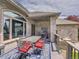 This patio offers a dining area with a blue rug, making the space feel even more welcoming at 4704 W Hinsdale Ct, Littleton, CO 80128