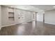 Finished basement area with built-in shelving, window, and sliding door to the outside at 15131 Munich Ave, Parker, CO 80134