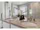 Bright bathroom featuring double sinks with granite countertop at 15131 Munich Ave, Parker, CO 80134