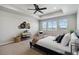 Bedroom features a ceiling fan and a large window at 15131 Munich Ave, Parker, CO 80134