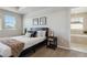 Well-lit bedroom with ensuite bathroom access at 15131 Munich Ave, Parker, CO 80134