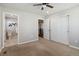 Spacious carpeted bedroom features an ensuite bathroom access and large closet at 15131 Munich Ave, Parker, CO 80134
