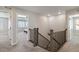 Upstairs hallway showcasing the staircase, with views into the bedrooms at 15131 Munich Ave, Parker, CO 80134