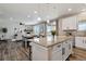 Open kitchen and dining area with granite island and stainless steel appliances at 15131 Munich Ave, Parker, CO 80134