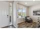 Bright home office with a large window, modern furniture, and hardwood floors at 15131 Munich Ave, Parker, CO 80134