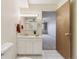 Clean bathroom with a mirrored vanity and neutral decor at 665 S Alton Way # 4B, Denver, CO 80247