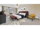 Well-lit bedroom with a large bed and modern furnishings at 665 S Alton Way # 4B, Denver, CO 80247
