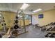 Gym weight training area with machines, free weights, and mirrors at 665 S Alton Way # 4B, Denver, CO 80247