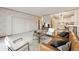 Comfortable living room featuring a soft couch and an open kitchen view at 665 S Alton Way # 4B, Denver, CO 80247