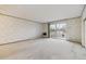 Spacious living room with sliding glass doors to a balcony at 665 S Alton Way # 4B, Denver, CO 80247