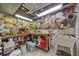 Functional basement workshop equipped with work bench, pegboard, and tool storage solutions at 8116 W Fremont Dr, Littleton, CO 80128