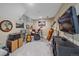 Finished basement designed as a music room with instruments and a TV at 8116 W Fremont Dr, Littleton, CO 80128